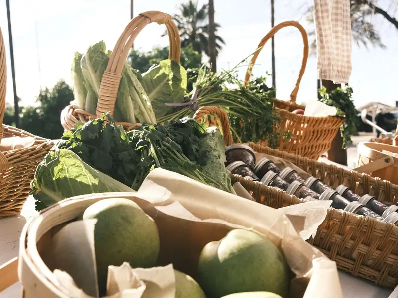 Fresh produce at a sunny farmers market stall